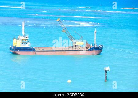 Hopper dredger at sea.Vessel engaged in dredging. Construction Marine offshore works. Dam building, crane, barge, dredger. Stock Photo