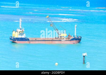 Hopper dredger at sea.Vessel engaged in dredging. Construction Marine offshore works. Dam building, crane, barge, dredger. Stock Photo