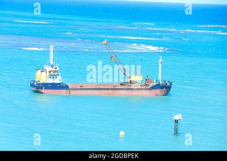 Hopper dredger at sea.Vessel engaged in dredging. Construction Marine offshore works. Dam building, crane, barge, dredger. Stock Photo