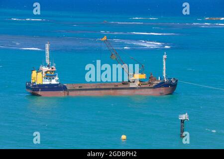 Hopper dredger at sea.Vessel engaged in dredging. Construction Marine offshore works. Dam building, crane, barge, dredger. Stock Photo