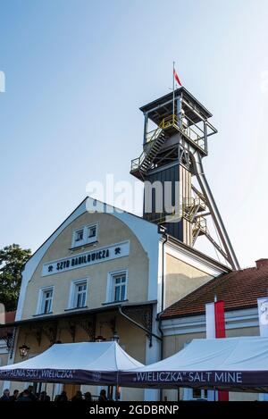 Krakow, Poland - August 29, 2018: Entrance of the Wieliczka Salt Mine with headframe and people around in Krakow, Poland Stock Photo