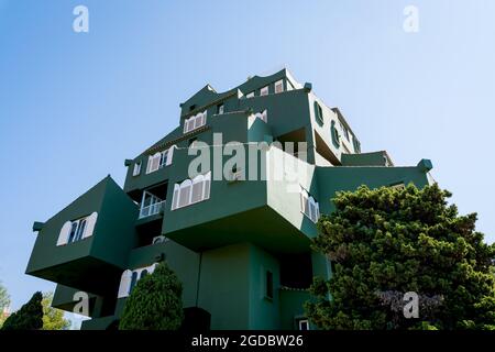 Calpe, Spain - 19 July 2021: Low angle view of the modern architecture apartment complex 'Edificio Xanadu' by Ricardo Bofill at the Costa Blanca Stock Photo