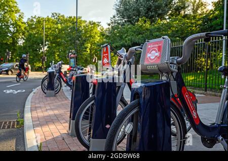 Rental bicycles stationed in Rotherhithe, London, UK. The bicycles, originally known as Boris Bikes are now sponsored by Santander Bank. Stock Photo