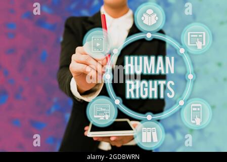 Conceptual display Human Rights. Word for the equality of fighting for your rights individuality Lady In Uniform Holding Tablet In Hand Virtually Stock Photo
