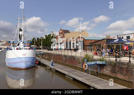 Boats moored in Hull Marina alongside Hull Waterfront on a sunny day in summer, Hull, Yorkshire UK Stock Photo