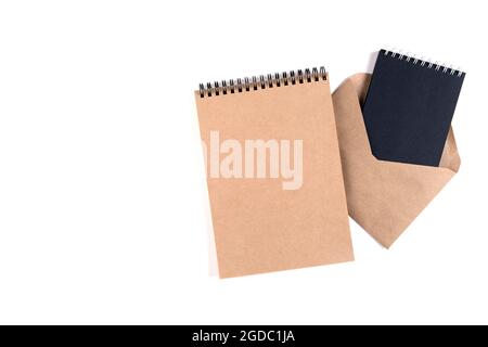 Blank spiral notepads and a recycled envelope Stock Photo