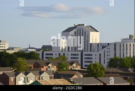 Manchester, UK. 12th Aug, 2021. UK weather: A high level view of Nick Everton House, Sanctuary Students Grafton Street accommodation, taken from the Ardwick district, Manchester, UK, in the sunshine of an August evening. Late sun falls on new houses in the foreground. Credit: Terry Waller/Alamy Live News Stock Photo