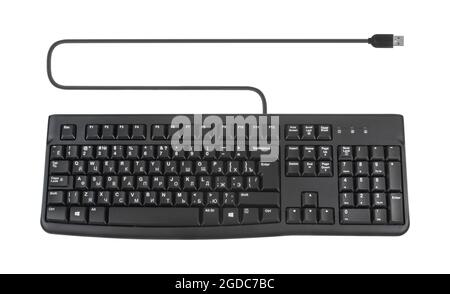 keyboard for a computer, wired with a wire and a connection plug, on a white background Stock Photo
