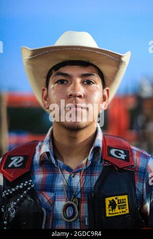 Cowboys, during the rodeo circuit in the new arena El Shejon with the participation of the brands Corona Buckles, Sonora Saddlery and Cas Cov Rodeo on July 17, 2021 in Carbo, Mexico. Cowboys sport, horse riding and Bull riding, a strong circuit in Chihuahua, followed by Sonora and Baja California Mex. and neighboring US states. Rodeo is a traditional American extreme sport influenced by the history of Spanish cowboys and Mexican charros. It consists of riding wild colts or wild cattle (such as steers and bulls) bareback and performing various exercises, such as throwing the lasso, rejonear, Stock Photo