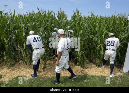 Dyersville, United States. 12th Aug, 2021. New York Yankees star Aaron Judge  walks through the cornfield from the movie set Field of Dreams as he gets  ready for game at an adjacent