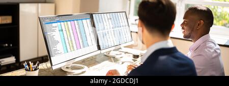 Spreadsheet Data On Computer Monitor In Office Stock Photo