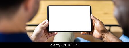 Couple Looking At Empty Tablet Computer Screen Stock Photo