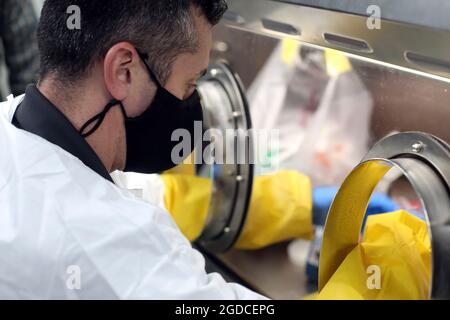 Maj. Wes Watson, Commander of the 10th Civil Support Team tests a COVID-19 collection sample in the mobile laboratory on behalf of the Washington Department of Health on January 5, 2021 in Shoreline, Wash. (U.S. National Guard photo by Joseph Siemandel) Stock Photo