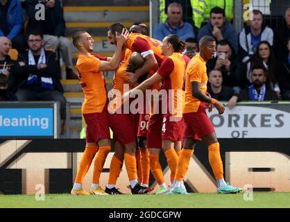 Galatasaray players celebrate after team-mate Sofiane Feghouli scores their side's third goal of the game during the UEFA Europa League third qualifying round, second leg match at McDiarmid Park, Perth. Picture date: Thursday August 12, 2021. Stock Photo