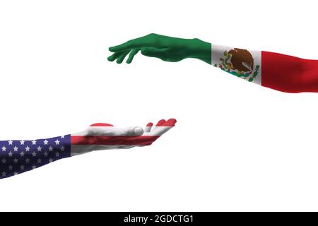 Hands painted in colors of Mexican and USA flags on white background Stock Photo