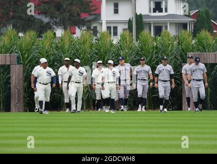 Dyersville, United States. 12th Aug, 2021. The Chicago White Sox and the New York Yankees emerge from a cornfield depicted in the 'Field of Dreams' film before participating in the MLB Field of Dreams Game in Dyersville, Iowa, Thursday, August 12, 2021. Photo by Pat Benic/UPI Credit: UPI/Alamy Live News