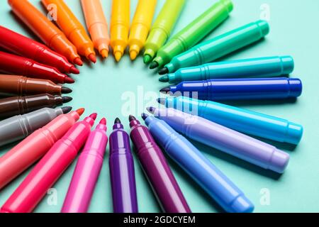 Frame made of markers on color background Stock Photo