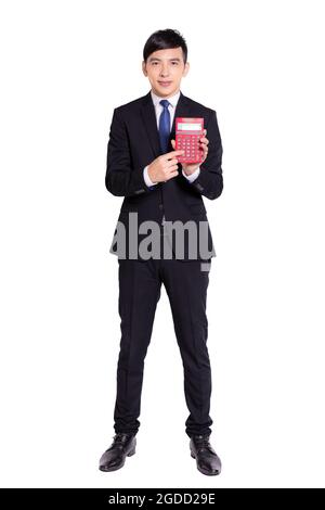 Young businessman pointing to calculator.Isolated on white background. Stock Photo