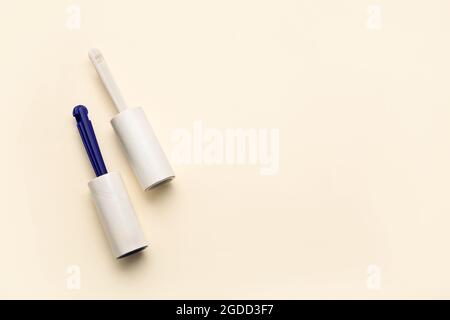 Lint rollers on color background Stock Photo