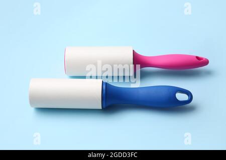 Lint rollers on color background Stock Photo
