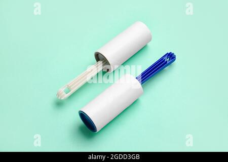 Lint rollers on color background Stock Photo