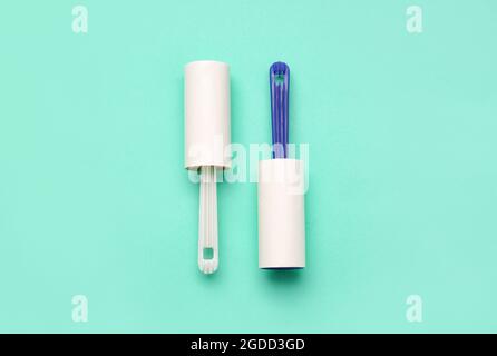 Lint rollers on color background Stock Photo