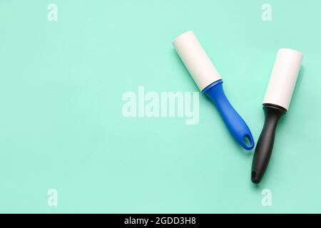 Lint rollers on color background Stock Photo