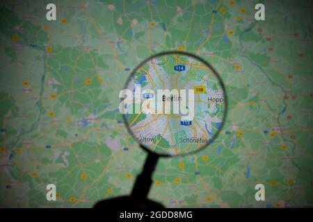 view of the city of Berlin, capital of Germany, through a magnifying glass on Google Maps Stock Photo