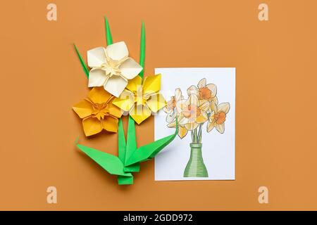 Origami narcissus flowers and greeting card on white background Stock ...