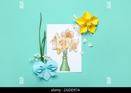 Origami narcissus flowers and greeting card on white background Stock ...