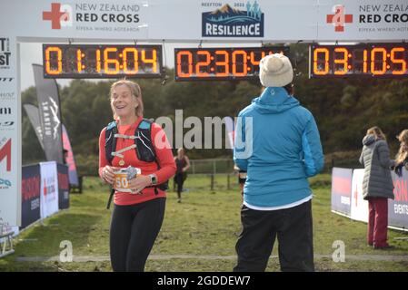 REEFTON, NEW ZEALAND, AUGUST 7, 2021; Competitor Elaine Baxter is delighted at completing the 10km section of the Red Cross Resilience Ultra endurance Stock Photo