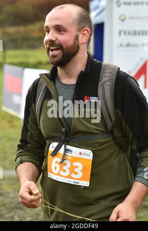 REEFTON, NEW ZEALAND, AUGUST 7, 2021; Competitor Jack Roxburgh looks jubilant after completing the 10km section of the Red Cross Resilience Ultra endu Stock Photo