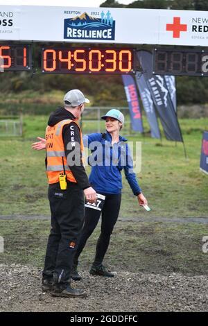 REEFTON, NEW ZEALAND, AUGUST 7, 2021; Competitor Naomi Brand meets race organiser after completing the 49km section of the Red Cross Resilience Ultra Stock Photo