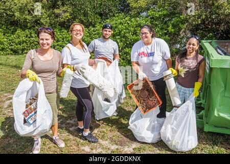 Miami Florida,Baynanza Biscayne Bay Cleanup Day,clean up volunteers volunteering workers working together students,Hispanic Black women female man col Stock Photo