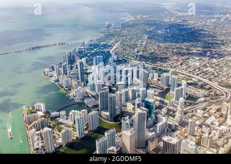 Miami Florida,Miami International Airport MIA,departing flight window seat aerial overhead above view,downtown Brickell Key Miami River Biscayne Bay, Stock Photo