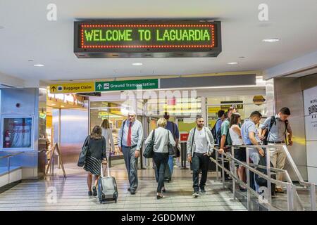 NY NYC,New York City,Queens,LaGuardia Airport LGA welcome sign interior inside terminal,arriving travelers, Stock Photo