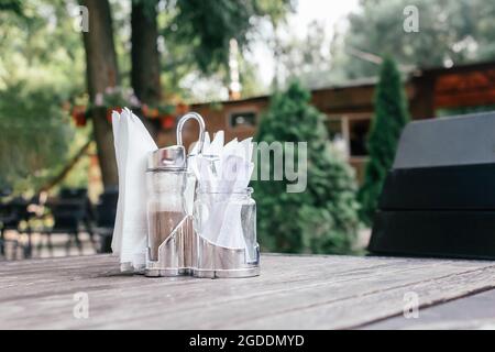 Napkins, pepper and toothpicks in metal coaster.  Stock Photo