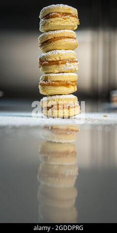 Alfajores: Traditional Peruvian cookies filled with caramel and white sugar dust on top Stock Photo