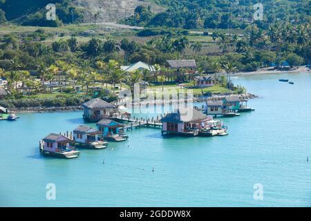 small houses in water in Amber Cove, Dominican Republic Stock Photo