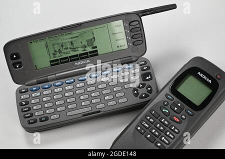 Heusenstamm, Germany. 10th Aug, 2021. An original 'Nokia 9000 Communicator' (r) and an opened dummy of the same design are in the collection of the Museum of Communication. The 'Communicator' went on sale on August 15, 1996 and was equipped with a fax function, calendar and calculator 25 years ago, ushering in the golden era of smartphones. (to dpa 'On the 25th birthday: What the smartphone can replace everything') Credit: Arne Dedert/dpa/Alamy Live News Stock Photo