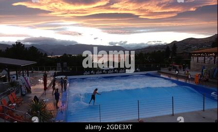Surfers surfing the World's larges standing wave at Lakeside Surf in