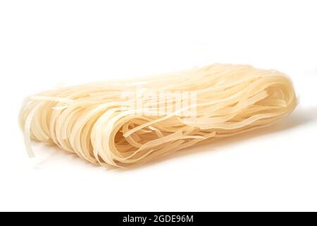 Raw Rice Noodles isolated on white background. Stock Photo