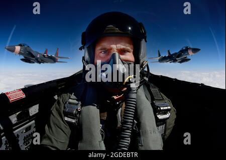 Tech. Sgt. Matthew Plew, 48th Fighter Wing Public Affairs photojournalist, takes a selfie while documenting two F-15E Strike Eagles and an F-15C Eagle conducting aerial maneuvers over southern England, Sept. 3, 2019. The 48th FW conducts routine training daily to ensure the unit brings unique air combat capabilities to the fight when called upon by U.S. Air Forces in Europe-Air Forces Africa. (U.S. Air Force photo by Tech. Sgt. Matthew Plew)