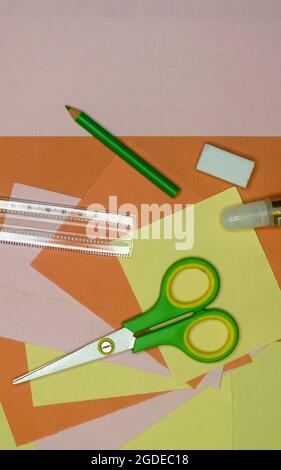 Set of school stationery supplies pencils, paint, ruler, and scissors lying on table. DIY Paper Crafts for kids. Back to school concept. Flat lay. Cop Stock Photo