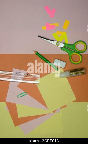 Set of school stationery supplies pencils, paint, ruler, and scissors lying on table. DIY Paper Crafts for kids. Back to school concept. Flat lay. Cop Stock Photo