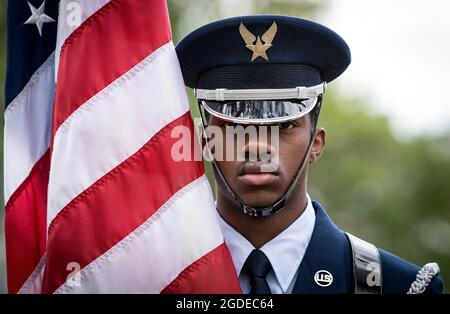 Senior Airman Rafael Edwin, 2nd Flight Test Squadron, stands ready to bring in the colors during the Eglin Air Force Base Honor Guard course graduation ceremony, Dec. 6, 2019, at Eglin AFB, Fla. The graduation performance includes flag detail, rifle volley, pall bearers and bugler for friends, family and unit commanders. (U.S. Air Force photo by Samuel King Jr.) Stock Photo