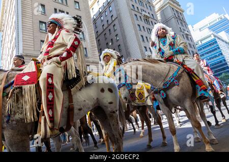 View of local Indians on the streets of Calgary celebrating the Stampede event. Stock Photo