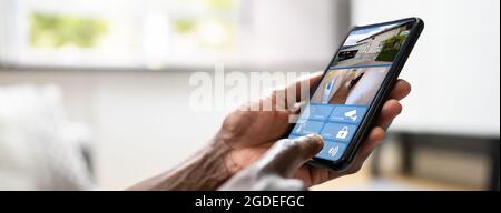 Smart Security System And CCTV Camera On Phone Stock Photo