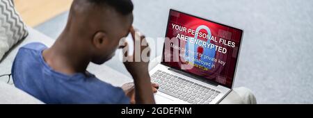 Ransomware Extortion Attack On Laptop. Cyber Security Stock Photo