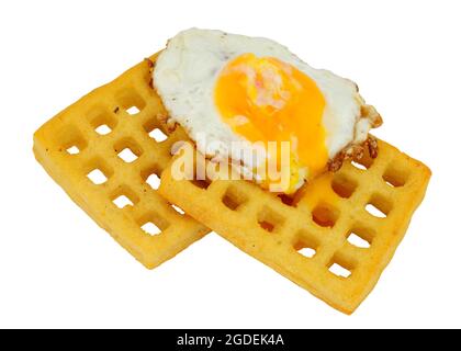 Crispy fried egg on a potato waffle isolated on a white background Stock Photo